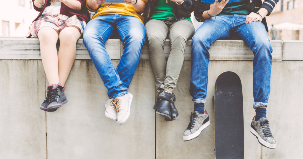 Youth sitting on wall