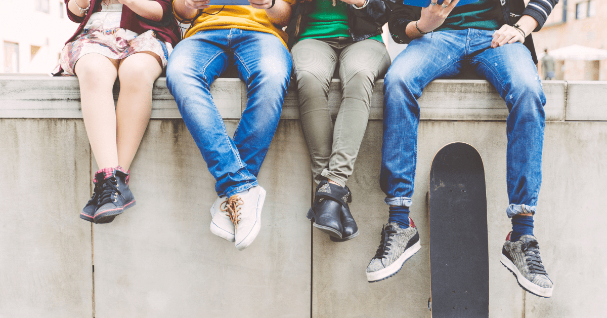 Youth sitting on wall