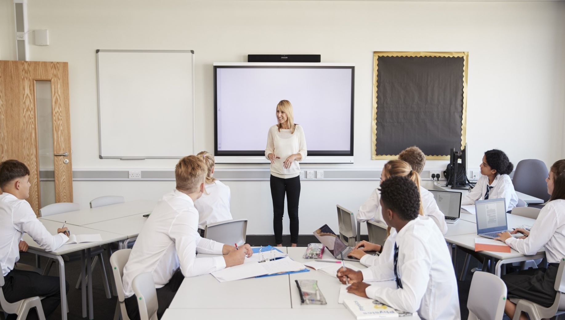Teacher in classroom with students