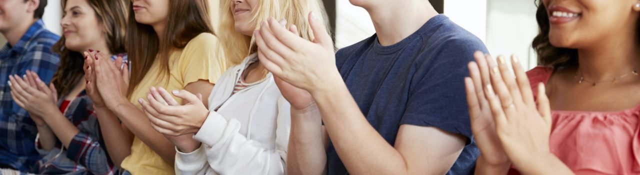 Group Of High School Students Applauding Presentation